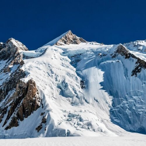 Climbers on the southwest ridge of Gasherbrum II with Karakoram peaks in the background