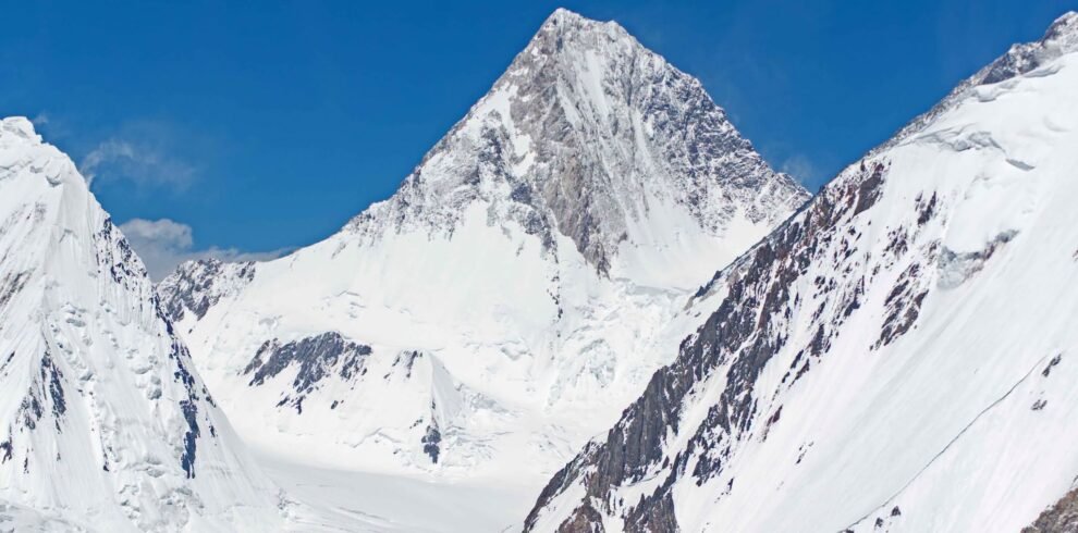 Climbers approaching the summit ridge of Gasherbrum I in the Karakoram, Pakistan