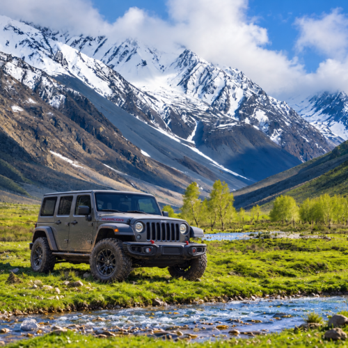 4x4 jeep crossing the high alpine plateau at Shandur Pass with Shandur Lake in view, Pakistan